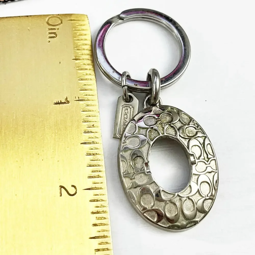 Coach Silver Tone Oval Signature C Keychain